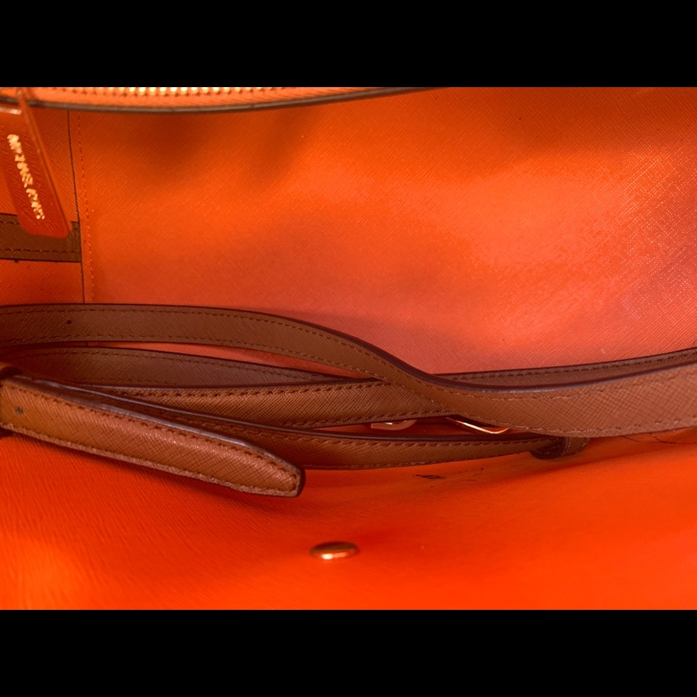 A beautiful cinnamon brown and orange interior Michael Kors tote